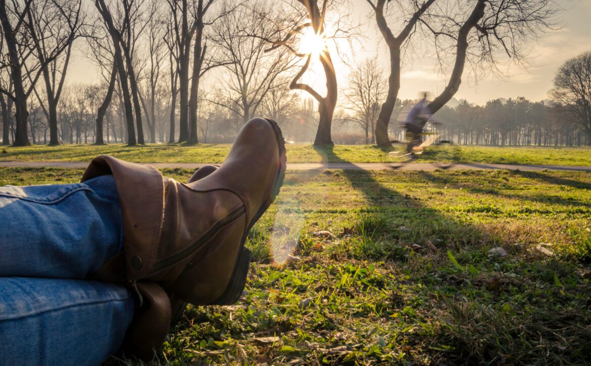 Woman in boots resting in nature